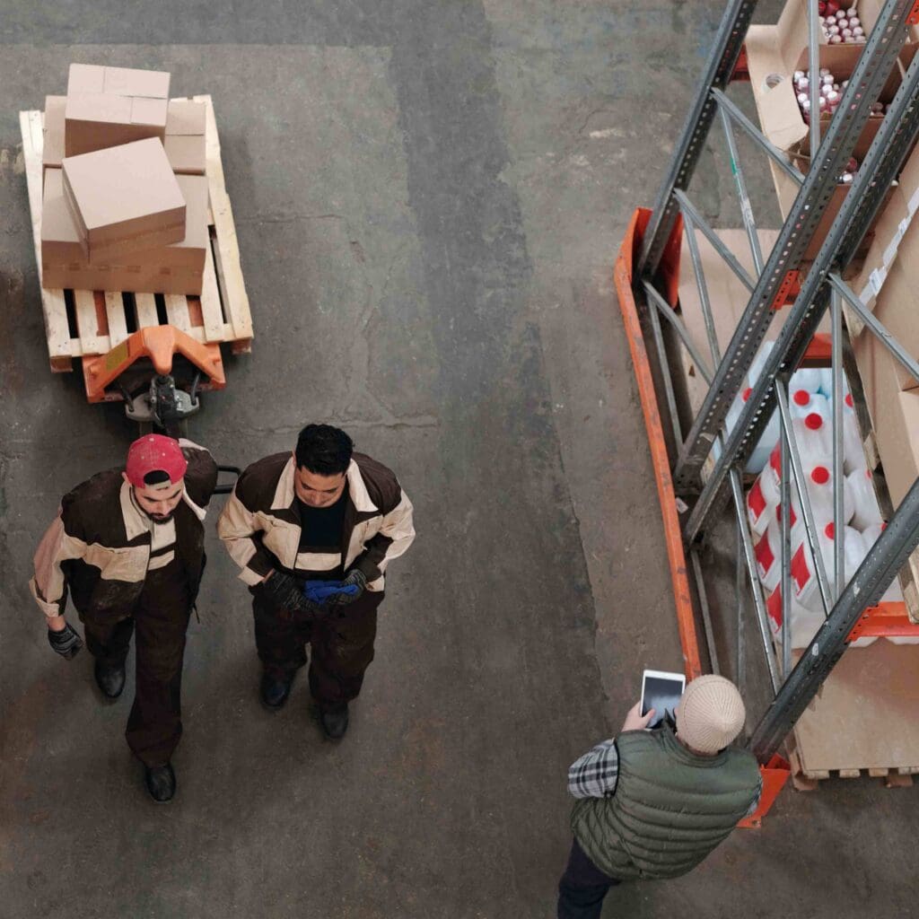 people 2 men warehouse interior